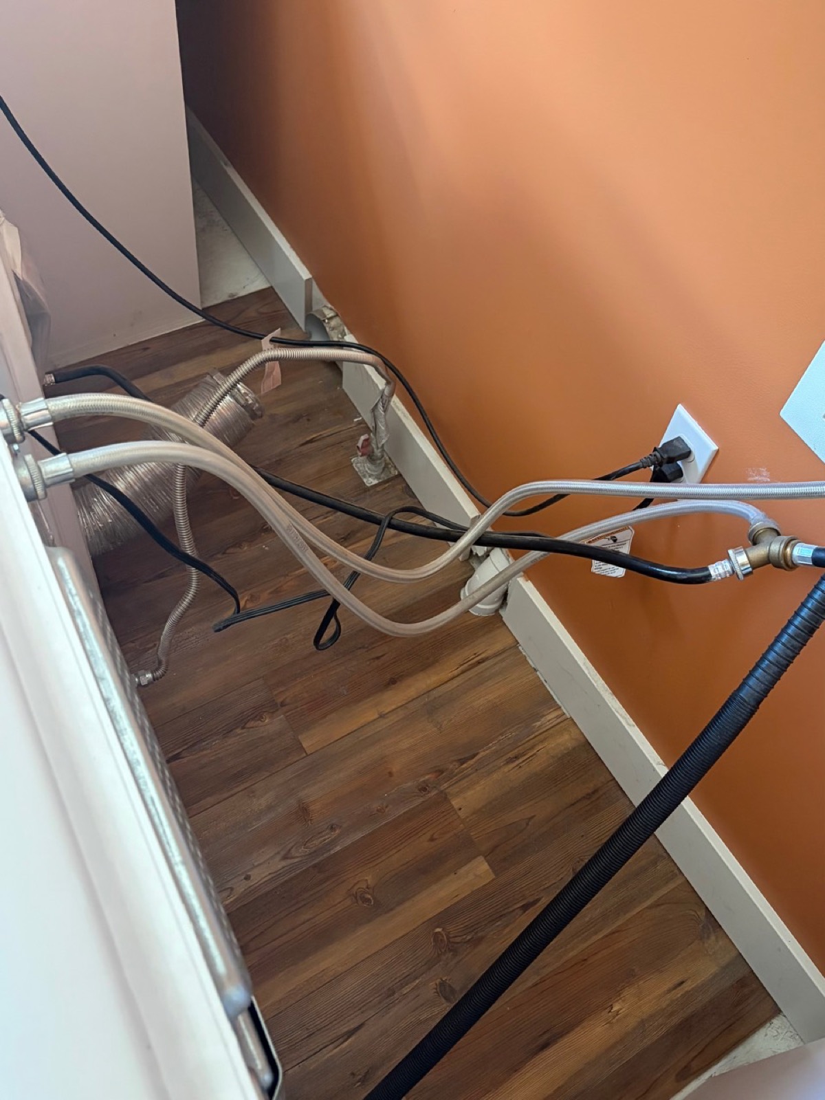 Cleaned space behind a dryer after service